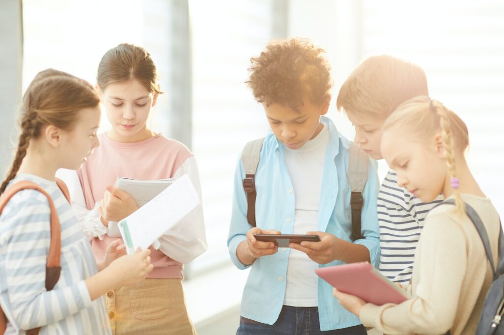 Busy Middle Schoolers In School Corridor